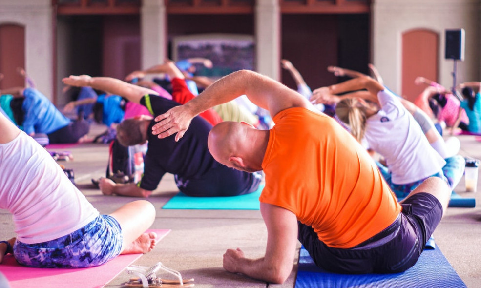 Group of people sitting on the floor exercise